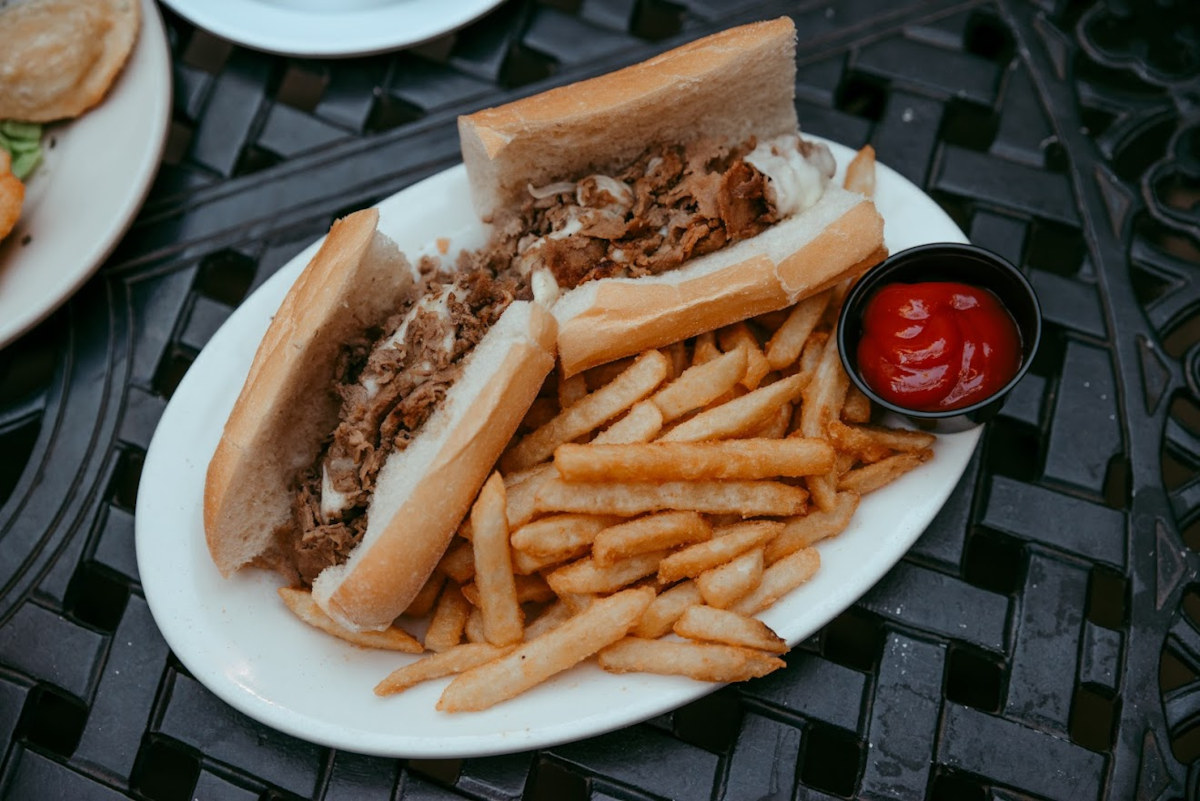 Two sandwiches, fries and dip